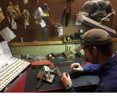 RSM technician keying locks at the shop workbench